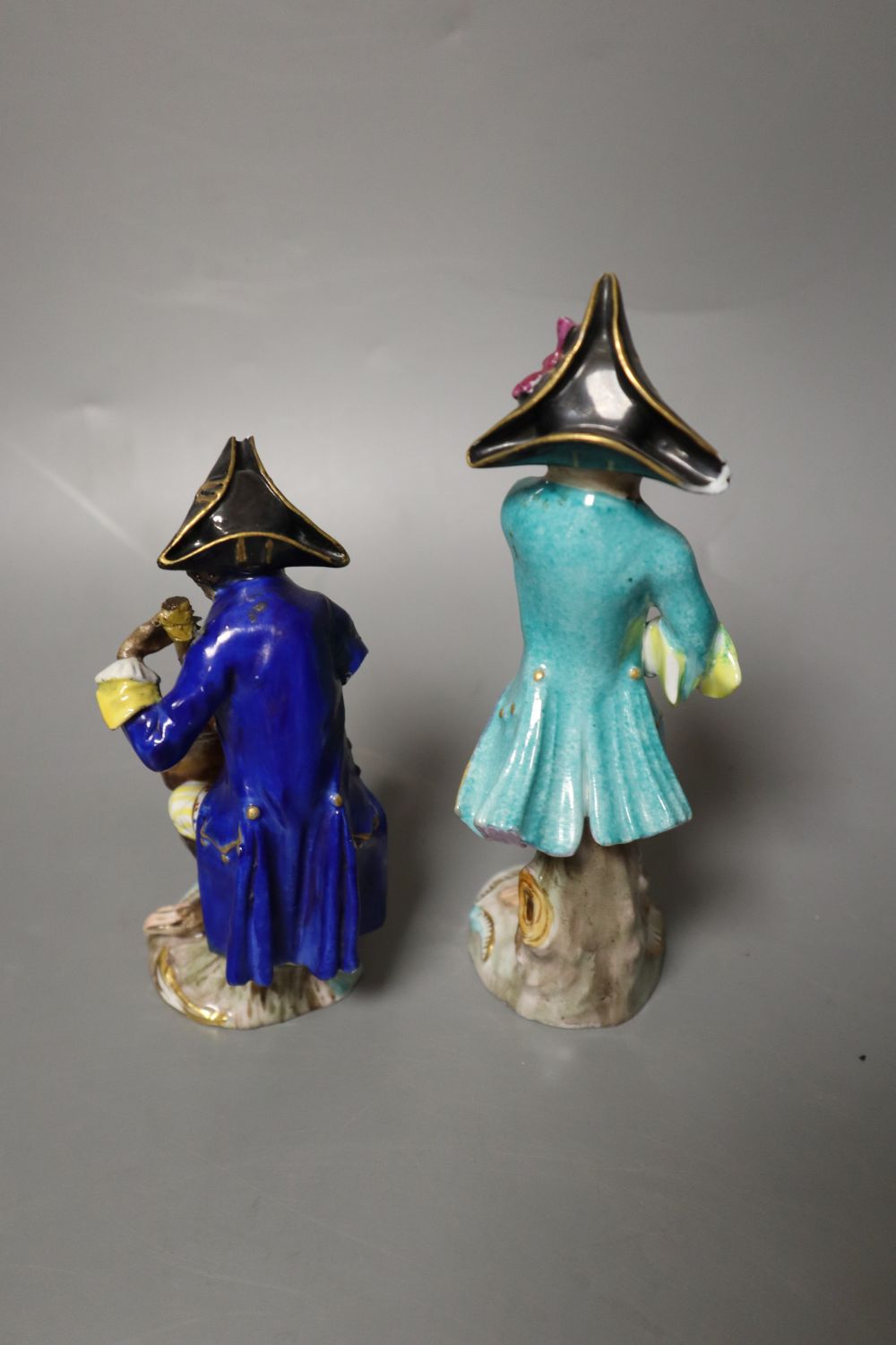 Six 19th century Meissen monkey band figures and another Volkstedt example, tallest 15cm